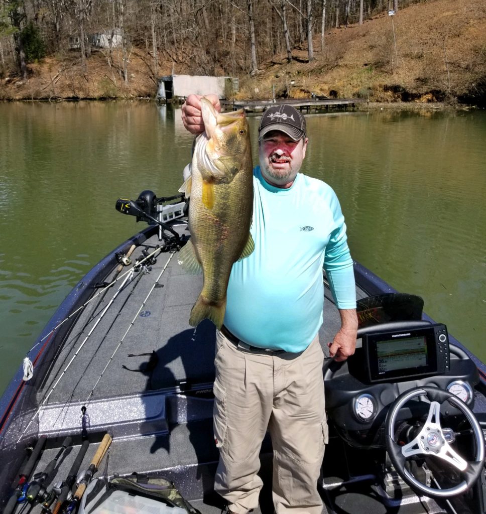 Fishing in Tuscaloosa County: Dalton Bobo catches a bass fish at Bankhead