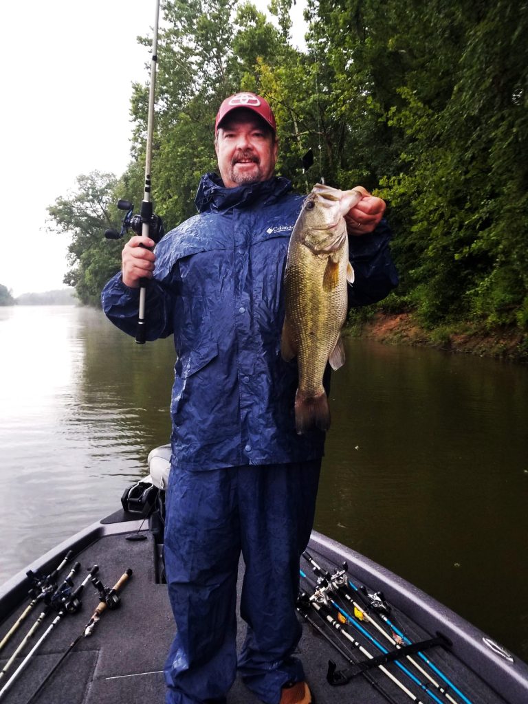 Fishing in Tuscaloosa County: Dalton Bobo catches bass fish in the Oliver Reservoir.