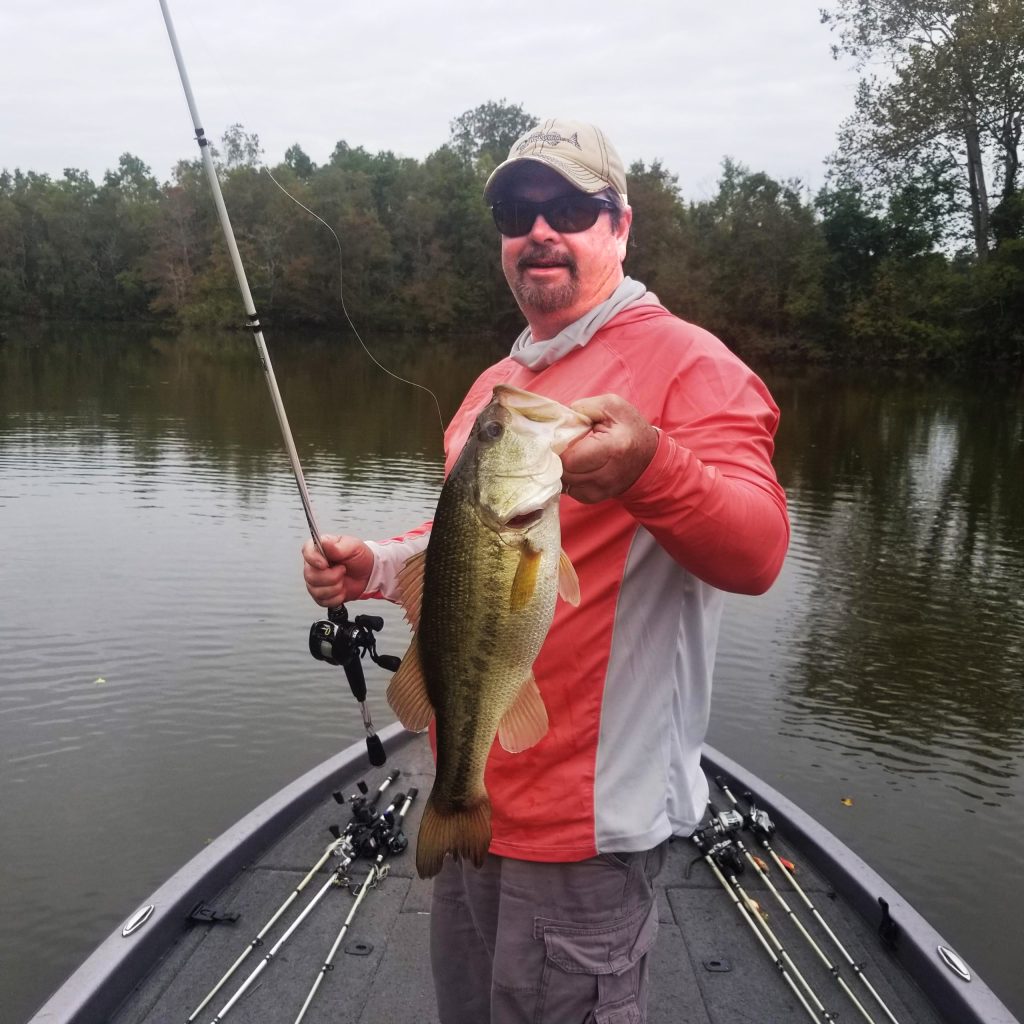 Fishing in Tuscaloosa County: Dalton Bobo catches a bass fish in the Black Warrior River