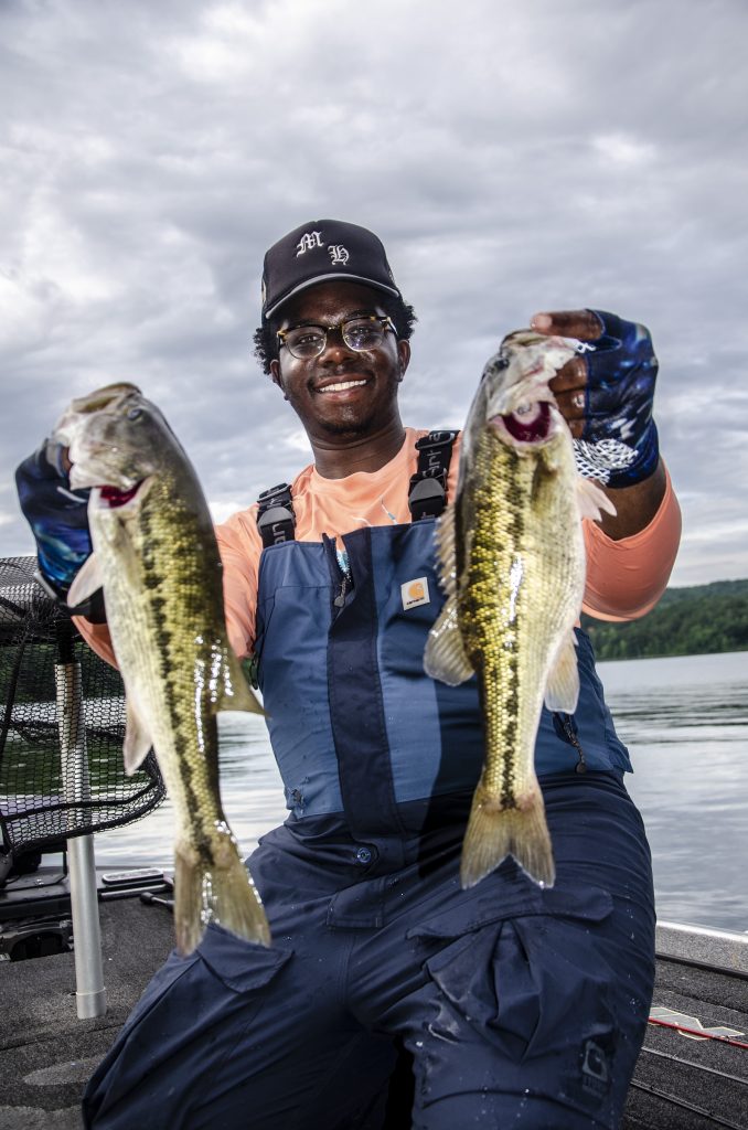 Conner holding his spotted bass that he caught. Fishing in Tuscaloosa County.