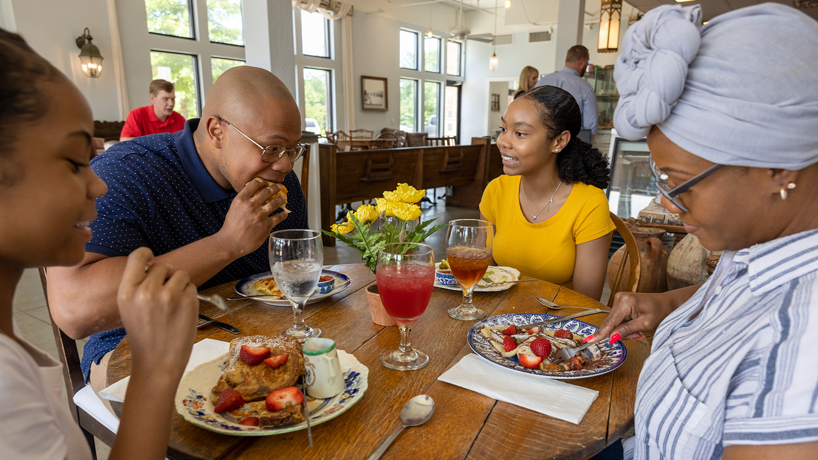 A family eating dinner together.