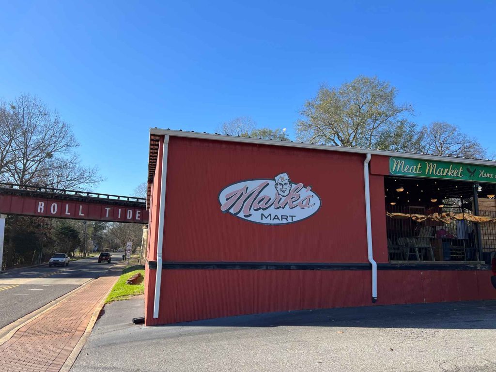 Mark's Mart with the Roll Tide bridge in the background
