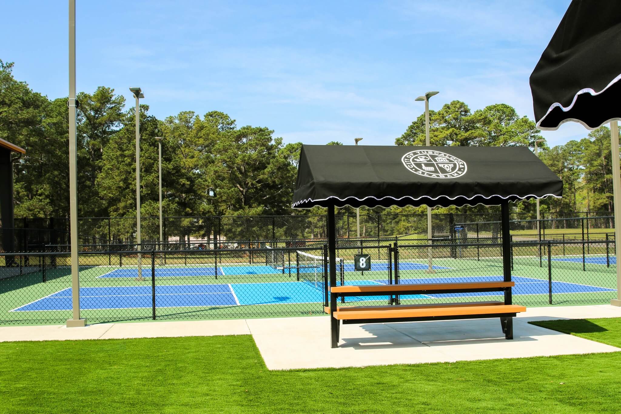 New pickleball courts at Bowers Park in Tuscaloosa featuring multiple courts, nets, and fencing.