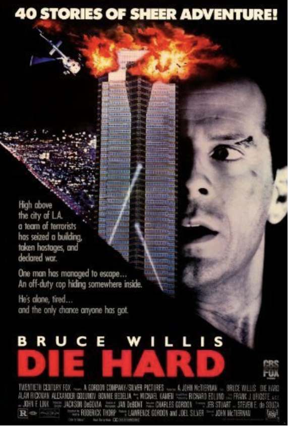 A man with a determined expression stands in front of burning skyscrapers, with a helicopter crashing into one of them in Tuscaloosa, Alabama.