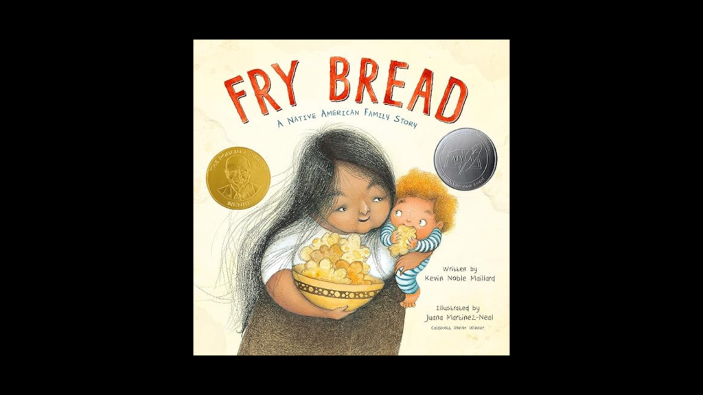 A Native American mother and child share a bowl of fry bread, a traditional family recipe in Tuscaloosa, Alabama.