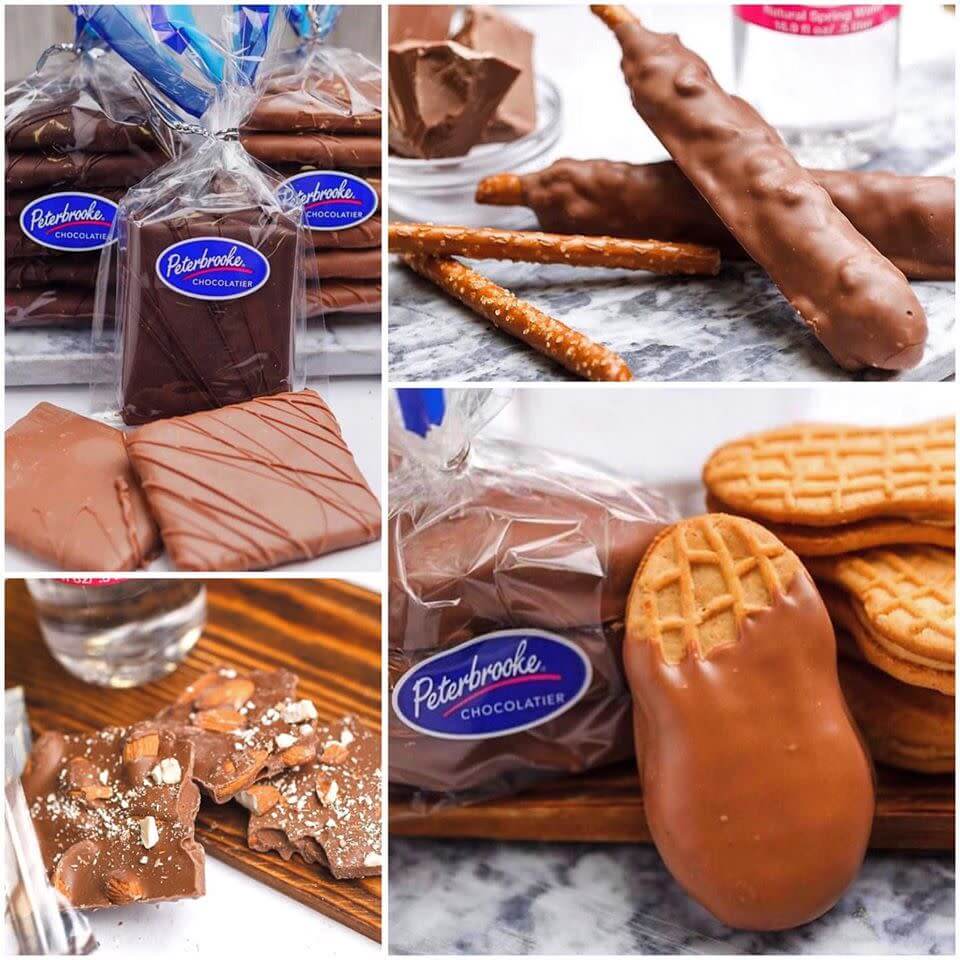 Assorted chocolate treats including pretzel rods, peanut butter cups, and chocolate-covered cookies from Peterbrooke Chocolatier in Tuscaloosa, Alabama.
