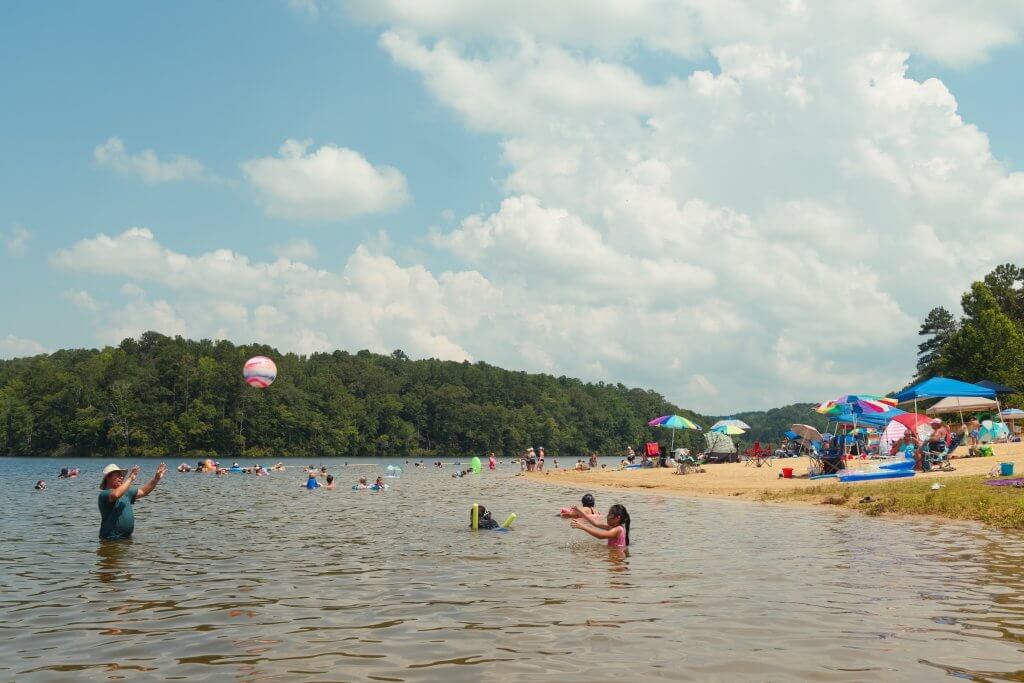Lake Lurleen State Park beach, where families enjoy swimming and relaxing