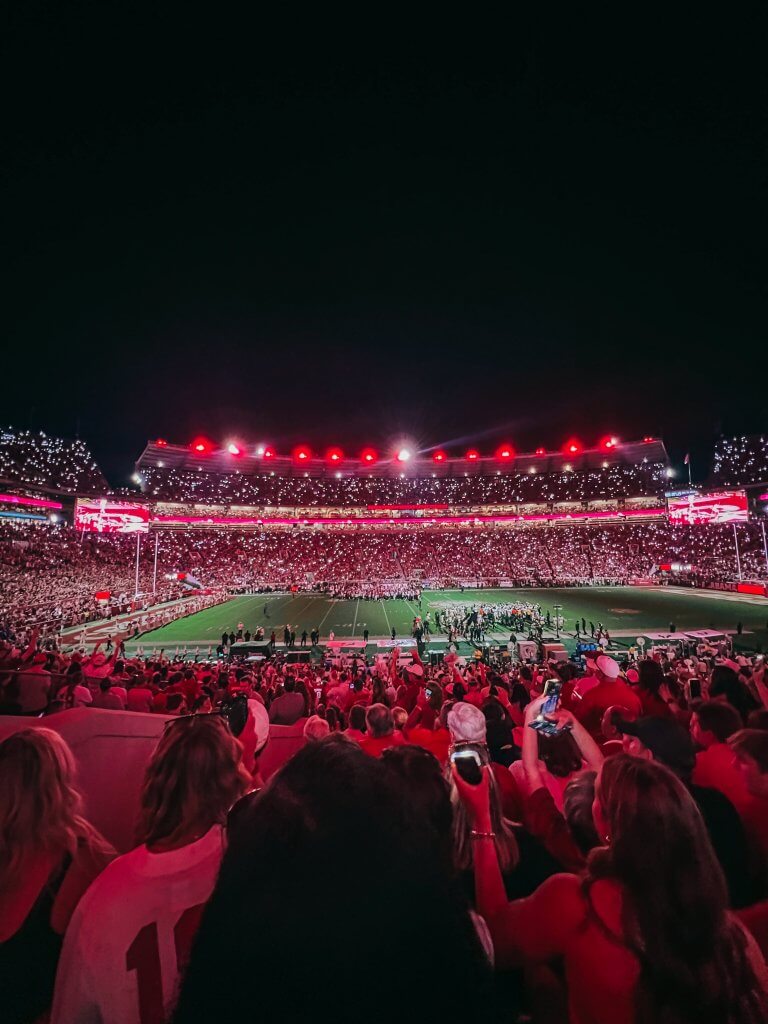 Bryant Denny Stadium in Tuscaloosa, Alabama under the lights during a night game.
