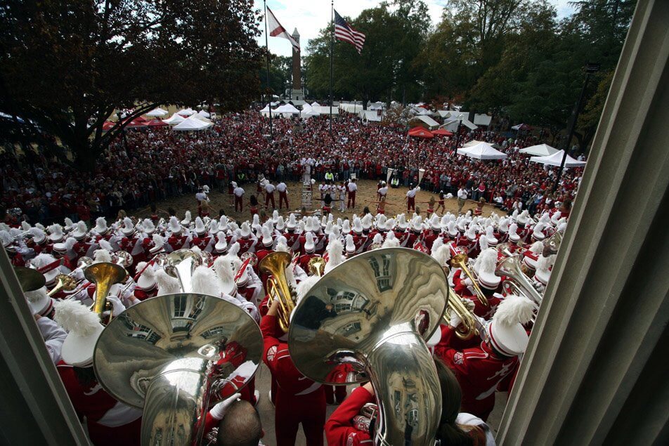 The Million Dollar Band performs the Elephant Stomp for a large crowd on an Alabama gameday in front of the Gorgas Library on the Quad in Tuscaloosa, Alabama.