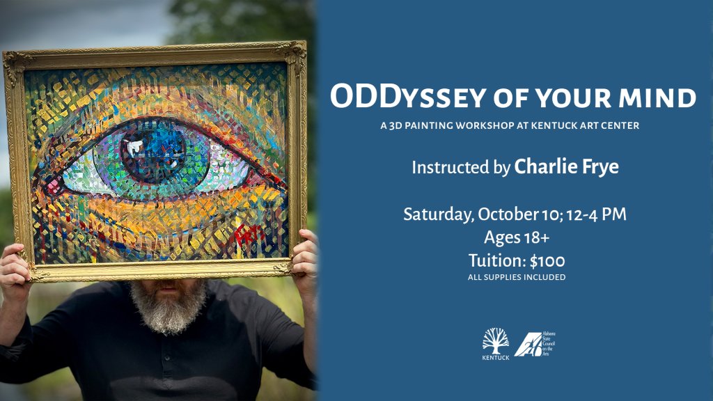 A man holds a framed painting of a large eye in front of his face in Tuscaloosa, Alabama.